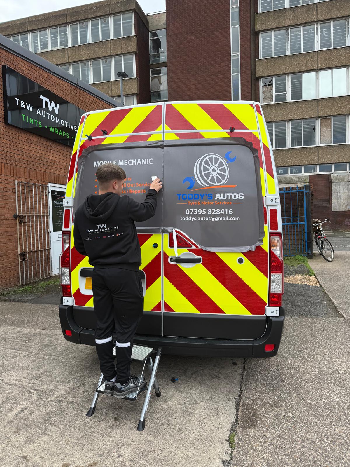 Commercial van graphics being fitted by T&W Automotive