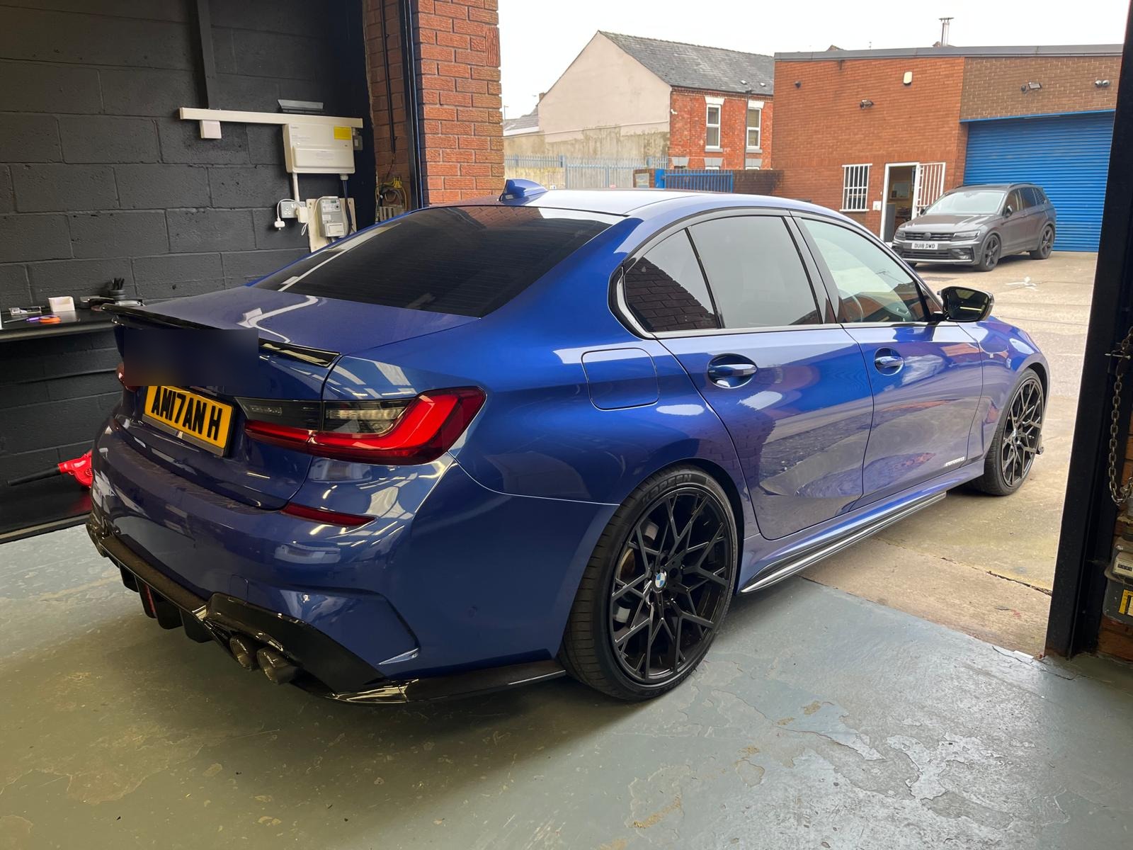 Blue BMW with tinted windows